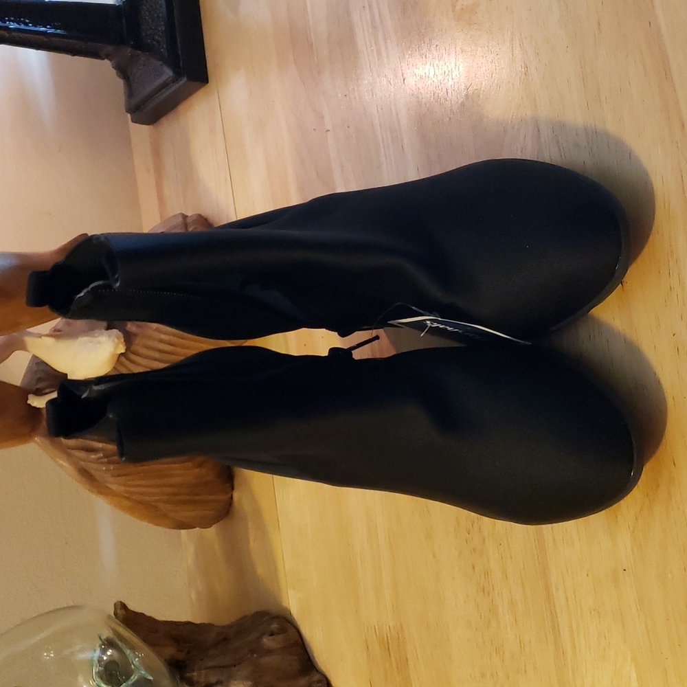 Brand new nylon Akxposure boots. 3 1/2 heel.